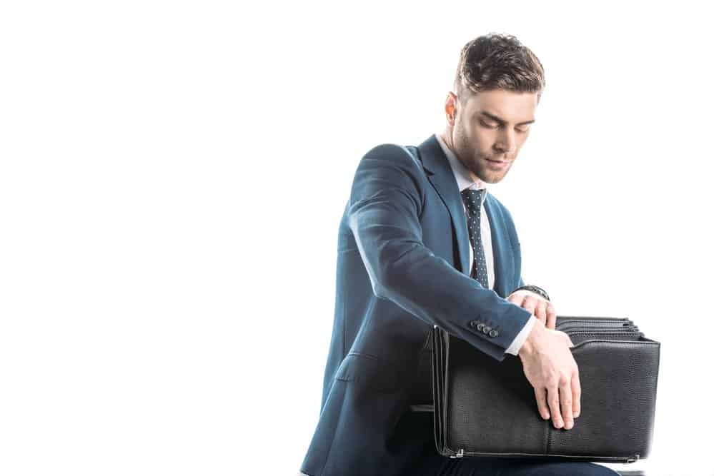 businessman looking into briefcase
