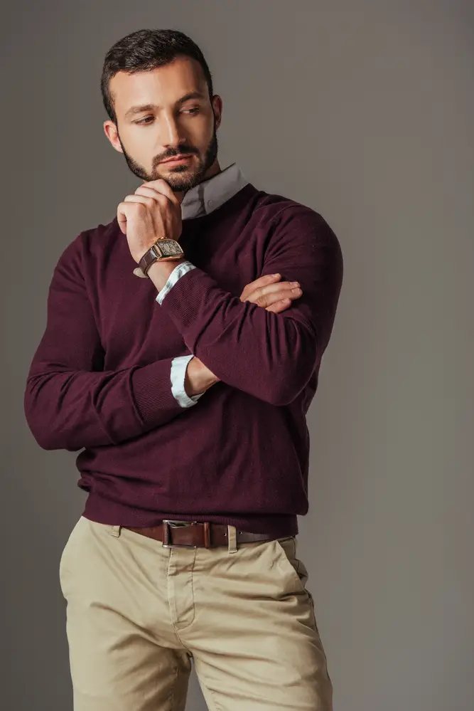Article: What to wear with Khaki Pants for men Image shows man in burgundy sweater and khaki pants