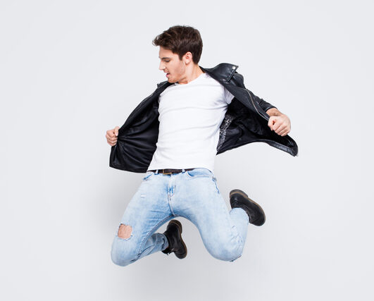man in black leather jacket white t shirt - carefree pose