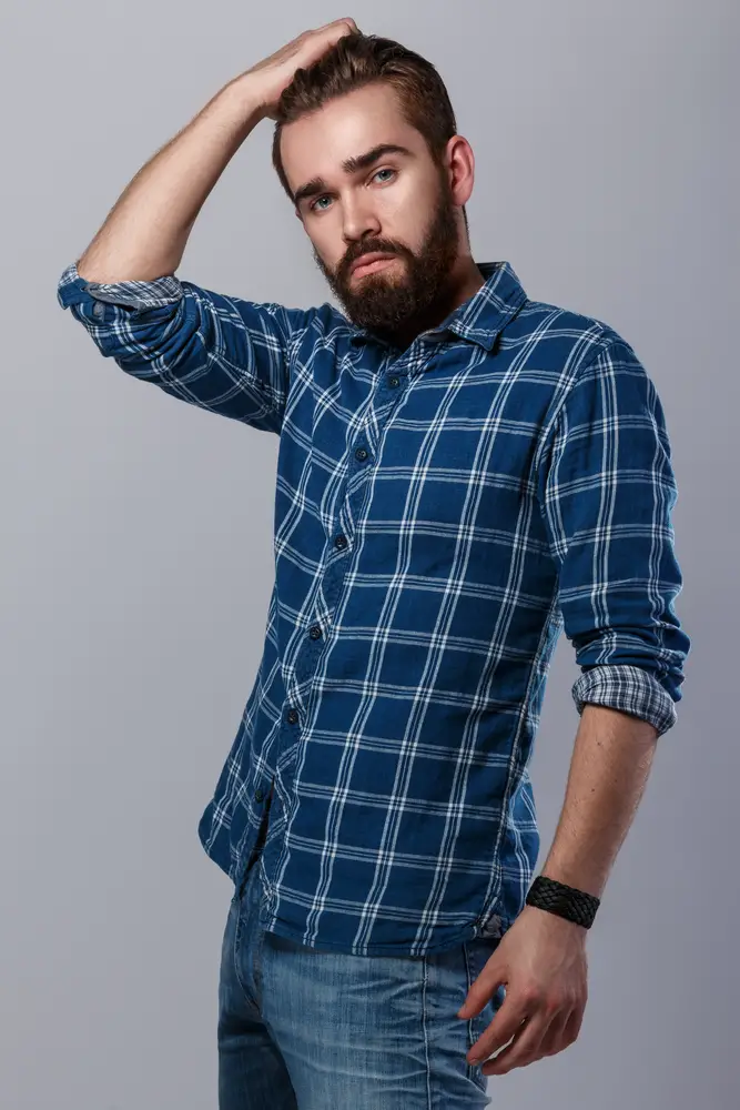 bearded man in checkered shirt